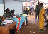 Defendant stands before judges at a mobile court