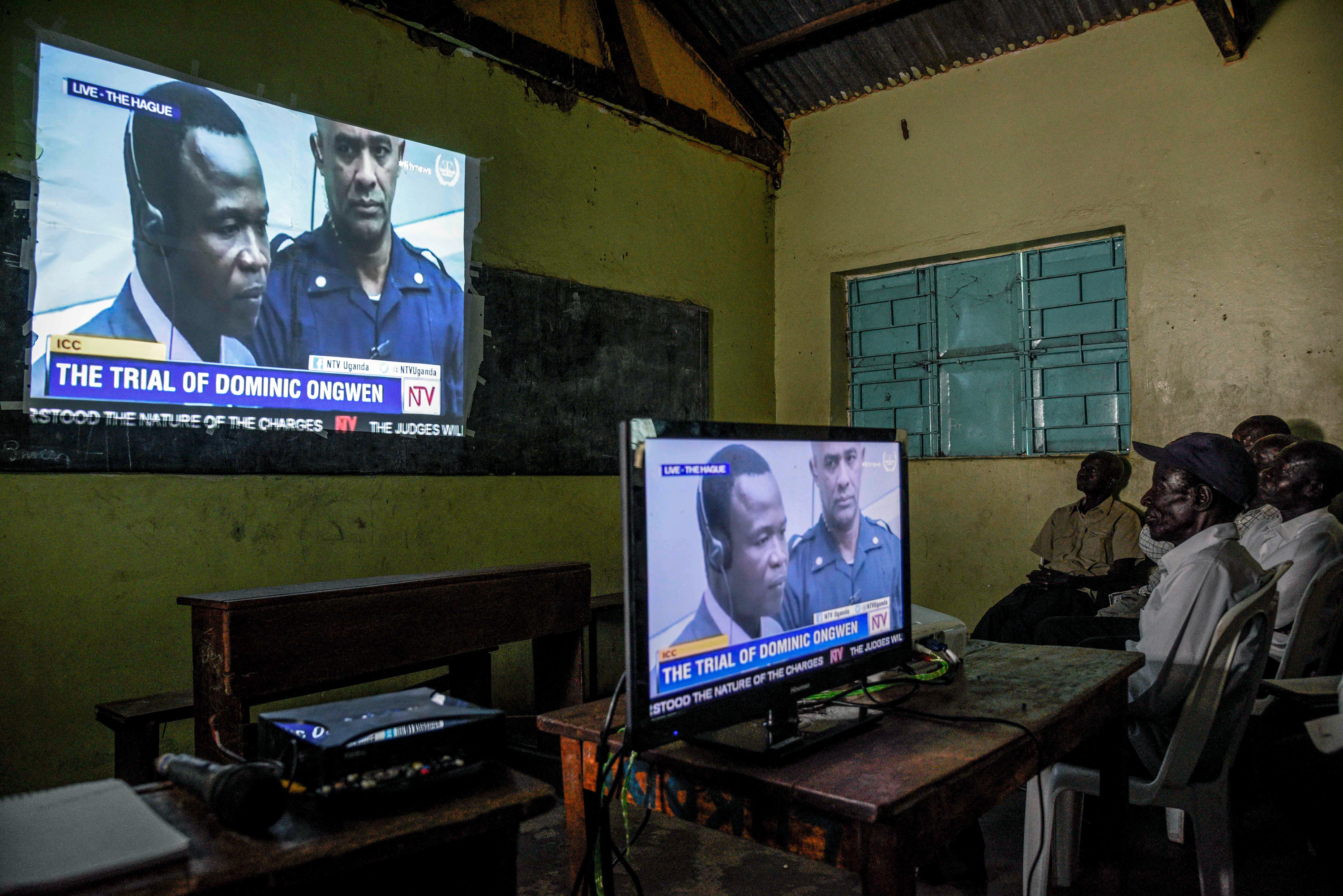 People watching news program on television