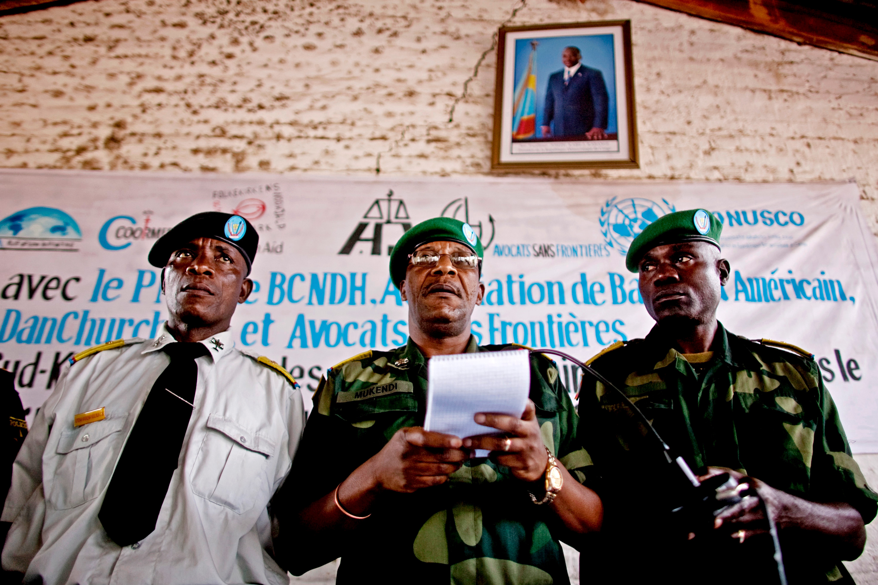 Three men in military uniforms