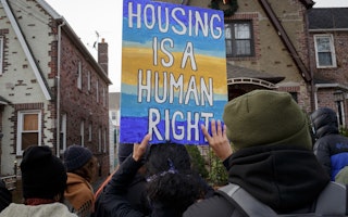 People gather for a protest for housing security in New York City.