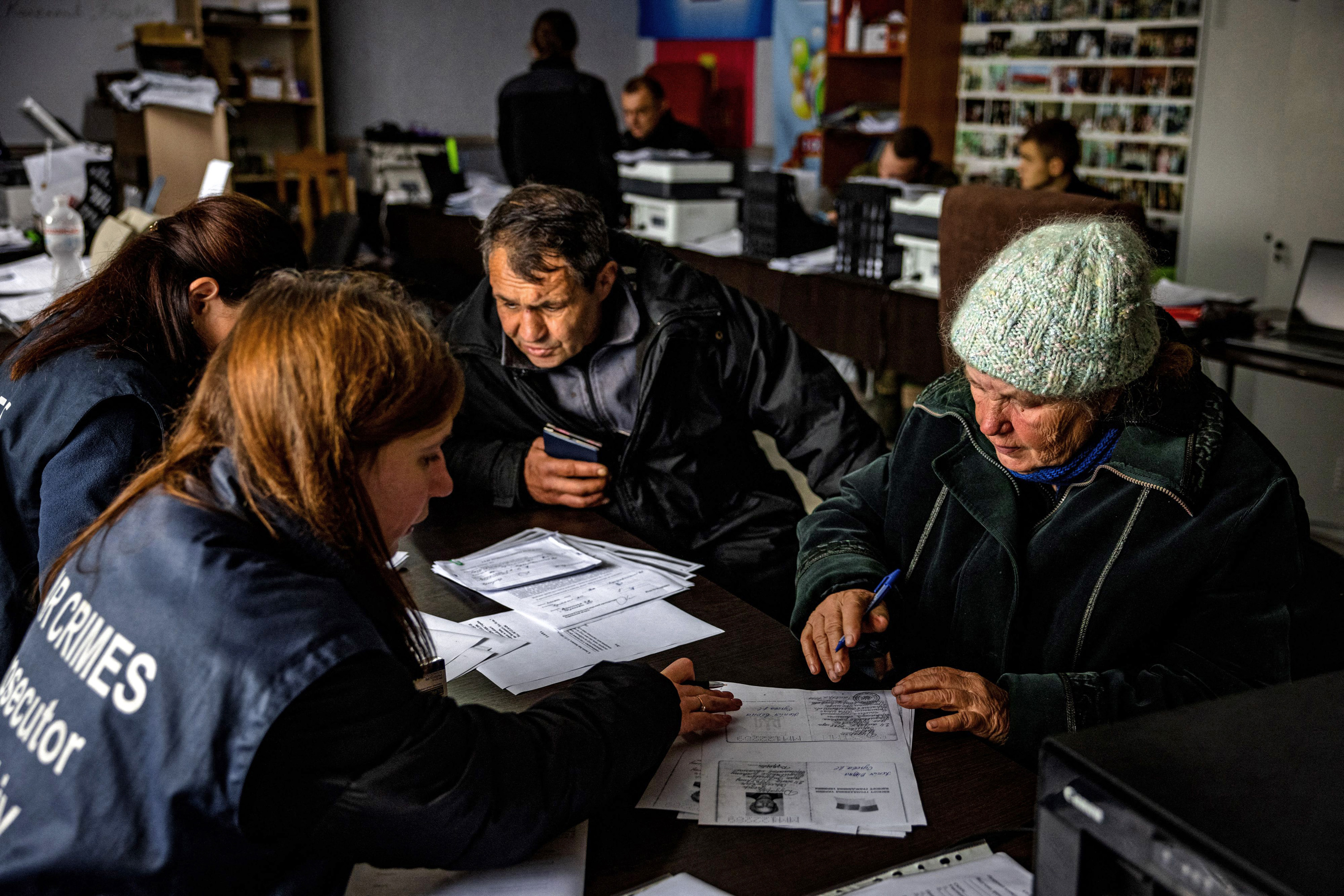 People analyzing documents at a table