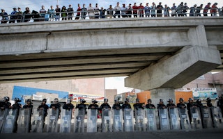 Police under a bridge in Tijuana, Mexico