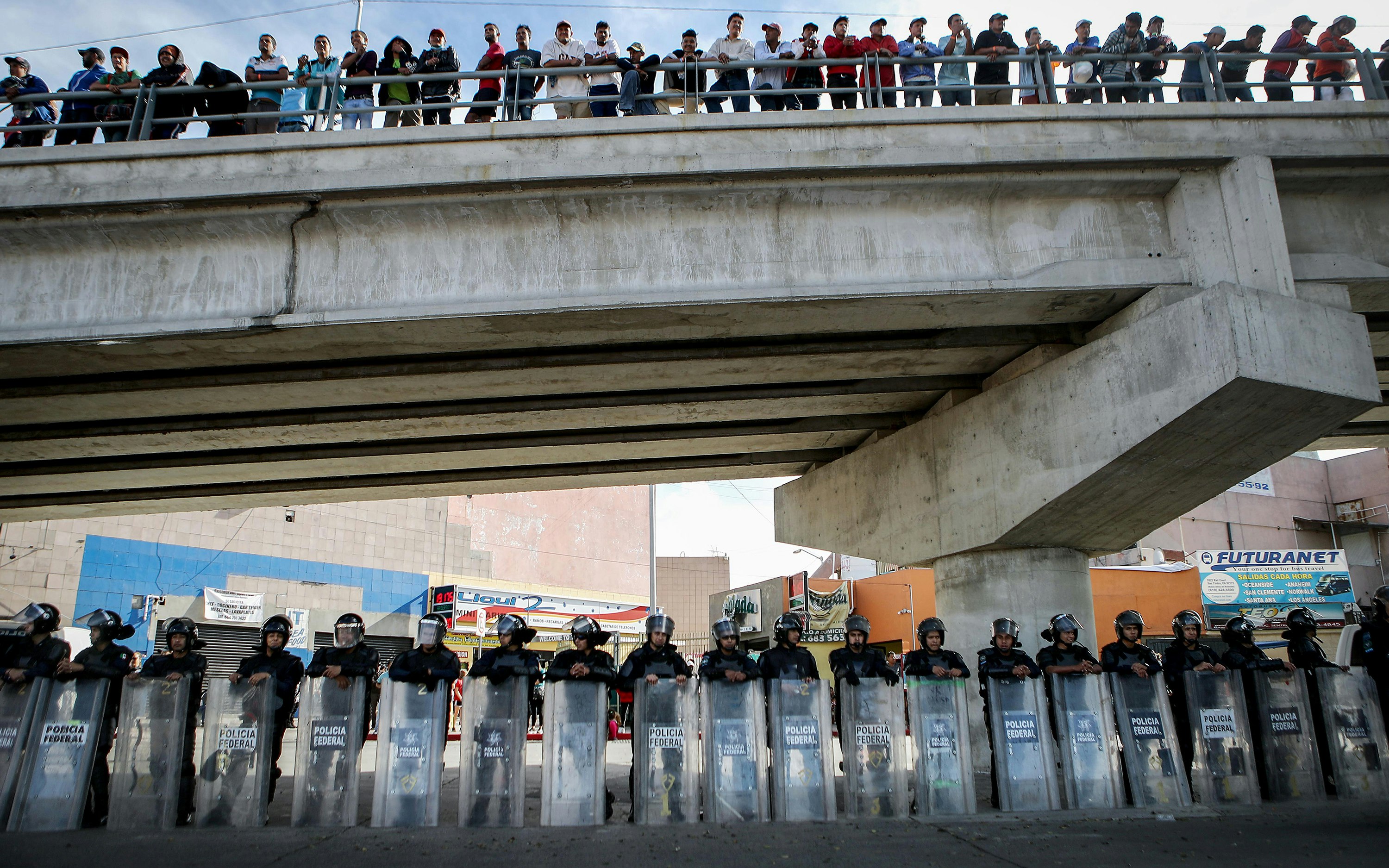 Police under a bridge in Tijuana, Mexico