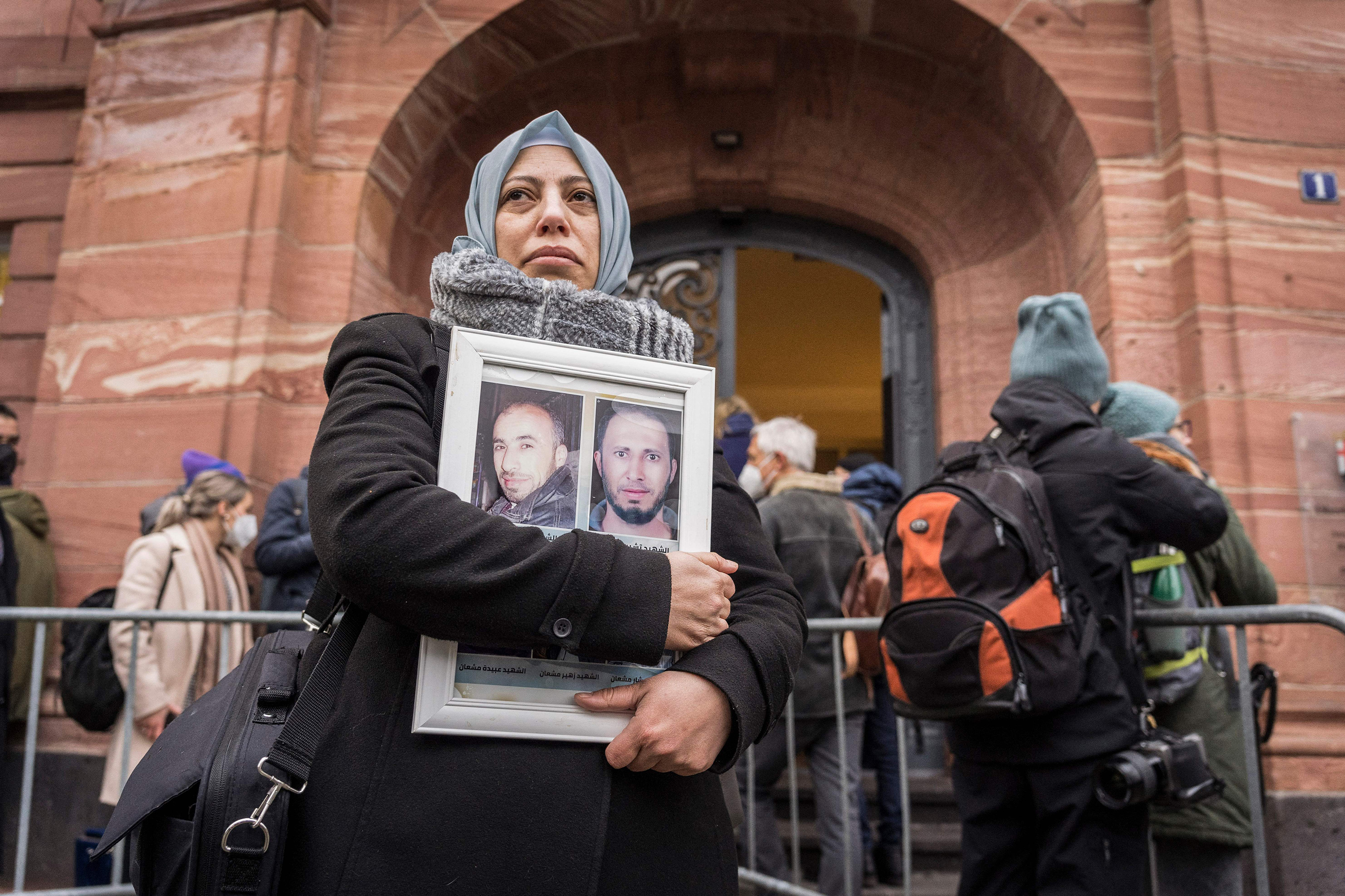 A woman holds photos